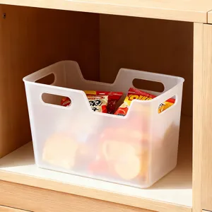 Translucent plastic storage basket with handles for home kitchen and fridge organization.