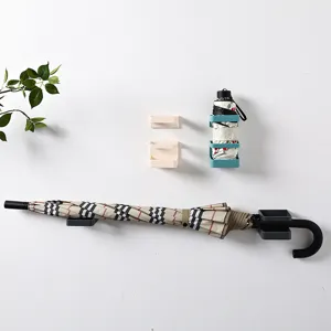 Wall-mounted umbrella rack punch-free plastic storage organizer for entryway and living room.