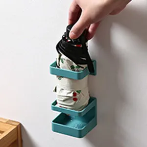 Wall-mounted umbrella holder punch-free draining storage rack for home entryway hallway.