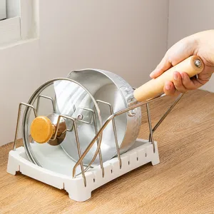 Adjustable pot rack kitchen organizer with stainless steel brackets and durable plastic base.