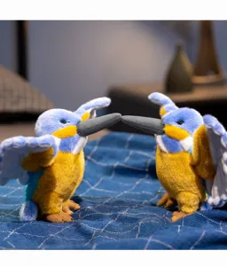 Kingfisher plush toy detail showing two cute stuffed birds facing each other on blanket.