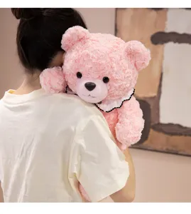 Close-up detail shot of a cute pink rose plush teddy bear with a lace collar, soft and cozy.