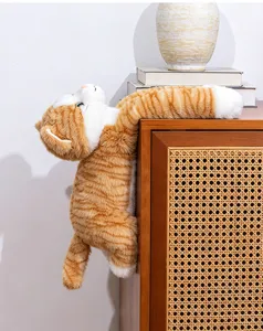 Cute hanging orange cat plush toy detail, soft stuffed animal doll for kids room decor.