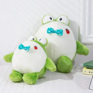 Simpatico peluche rana rotonda e grassa, bambola di stoffa verde e bianca con fiocco morbido.