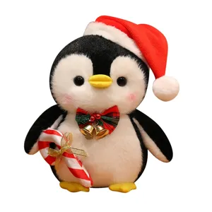 Christmas penguin plush toy with Santa hat and candy cane, soft stuffed doll for kids
