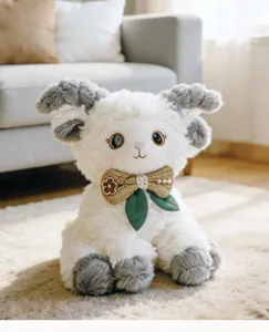 Cute plush lamb toy detailed close-up, soft white fleece with lovely grey ears and bow tie.