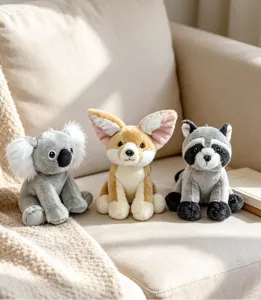 Detailed scene of three cute plush animal toys, koala, fox and raccoon on cozy sofa.