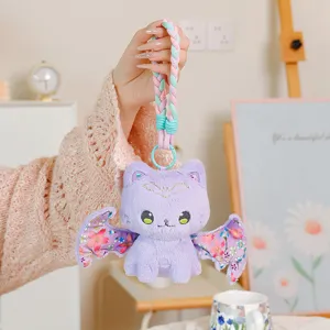 Cute purple bat cat plush doll keychain, detailed wings and braided strap close up view