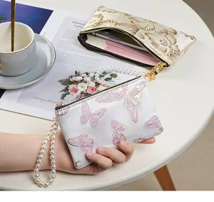 Chinese style embroidered coin purse with pearl wrist strap for women elegant wallet bag