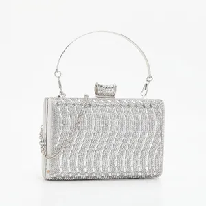 Silver rhinestone evening clutch bag with metal round handle and chain strap for women party dress.