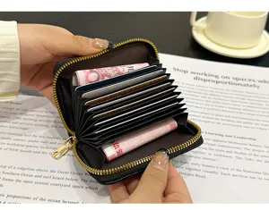 Black leather accordion card wallet for women with multiple slots and secure zipper closure.