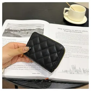 Quilted leather card holder detail, black zip card case, compact credit card wallet.