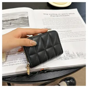 Black quilted card holder with zipper closure, compact design for daily use and multiple cards.