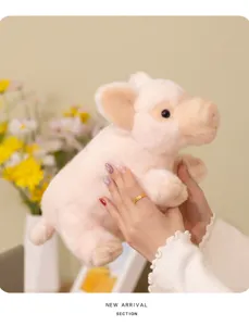 Detailed shot of a cute pink plush pig toy, soft stuffed animal doll for kids comfort.