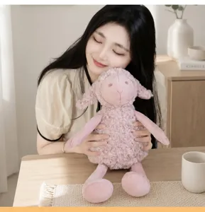 Close-up of a cute pink curly plush sheep toy with long legs, soft and comforting for kids.