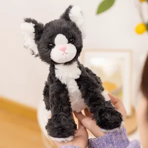 Cute black and white cat plush toy, fluffy kitten doll, soft companion stuffed animal for kids.