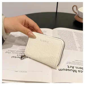White compact card holder with heart zipper pendant, stylish and portable coin purse for daily use.