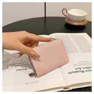 Close-up detail of the pink PU leather zipper card holder showcasing compact multi-card storage.