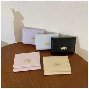 Short wallet set with cute metal bow detail, premium leather multiple card slots design.