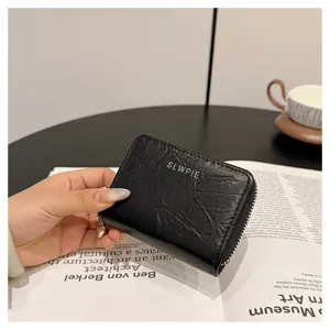 Black faux leather zipper card holder wallet detail view compact coin purse with heart zipper pull