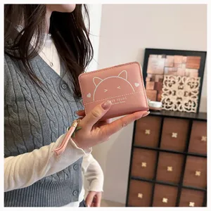 Pink PU leather short wallet detail view, featuring cute cat graphic and zipper tassel design.