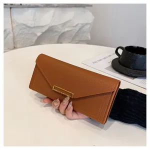 Brown long envelope wallet detail, slim card holder clutch with metal clasp display.