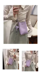 Cute leather mini crossbody phone bag for women with elephant charm and woven strap.