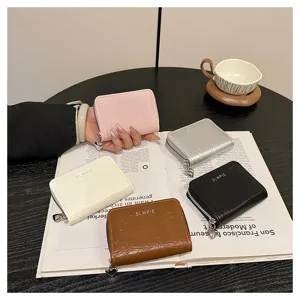 Compact PU leather zipper coin purse and card holder with cute heart pendant for daily use.