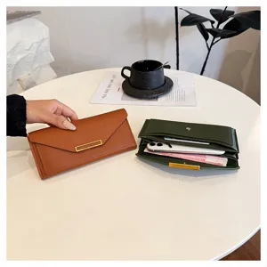 Detailed view of women's long PU leather wallet with metal bar closure, elegant and spacious.