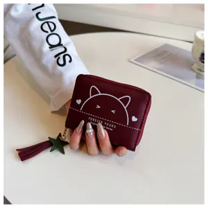 Compact PU leather wallet with cute cat graphic, zipper closure, and chic tassel charm.