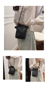 Black mini vertical crossbody phone bag with cute elephant charm for women casual style