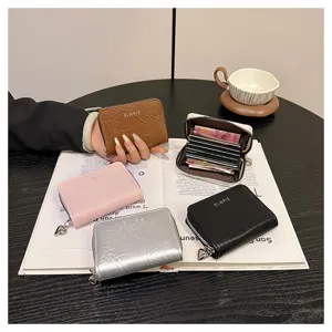 Detail view of compact multi-slot card holder wallet with cute heart zipper pull and stylish finish.