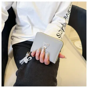 Grey short wallet for women with cute bear metal decor, zipper coin purse and tassel pendant.