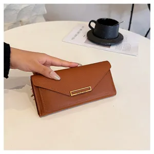 Brown long wallet detail showing texture and metal clasp design for women daily use.
