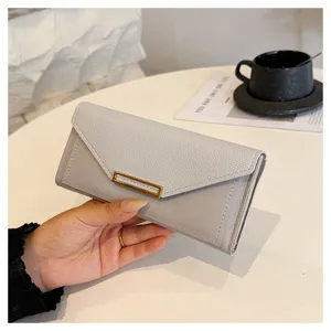 Close-up display view of the stylish light gray women long wallet showcasing elegant detail.