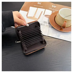 Detailed view of the retro PU card holder with multiple slots and secure zipper closure.