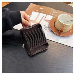 Detailed view of the retro accordion card holder with multiple card slots and secure zipper.