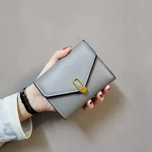 Grey short women wallet folding card holder with metal clasp stylish minimalist design detail view