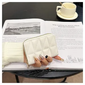 Exquisite white quilted lamb pattern card holder featuring multiple accordion slots and zip closure.