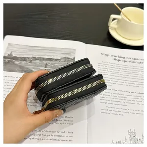 Black lambskin pattern accordion card holder double zipper wallet detail view showcasing card slots.