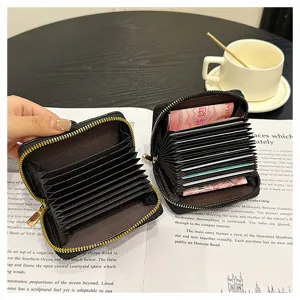Portacarte trapuntato nero con cerniera, portafoglio compatto minimalista per carte.