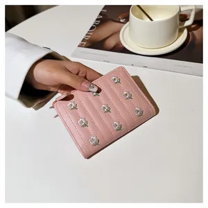 Women's pink short wallet with delicate floral embroidery, folding card holder and zipper pocket.