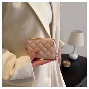Chic pink quilted cardholder with secure zipper closure, elegant compact wallet for women daily use.