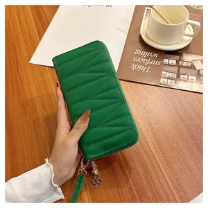 Green quilted long zip wallet with wrist strap and clover charm for women large capacity clutch.