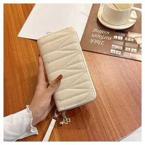 Quilted long wallet for women, stylish large capacity zip clutch purse with strap.