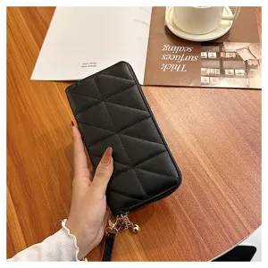 Black quilted long wallet for women, large capacity zipper clutch purse with wrist strap.