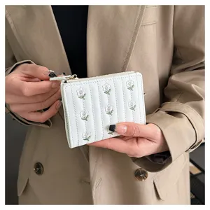 Floral embroidered short wallet for women, cute folding coin purse with zipper and card slots.