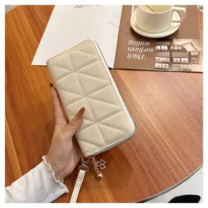 Quilted long wallet for women, chic zip clutch purse with card slots and wrist strap.