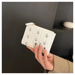 Detailed view of the cute floral embroidered short wallet with convenient card slots and zipper.