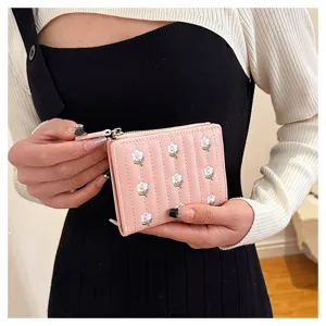 Pink quilted short wallet with cute embroidered white floral pattern, compact zipper coin purse.